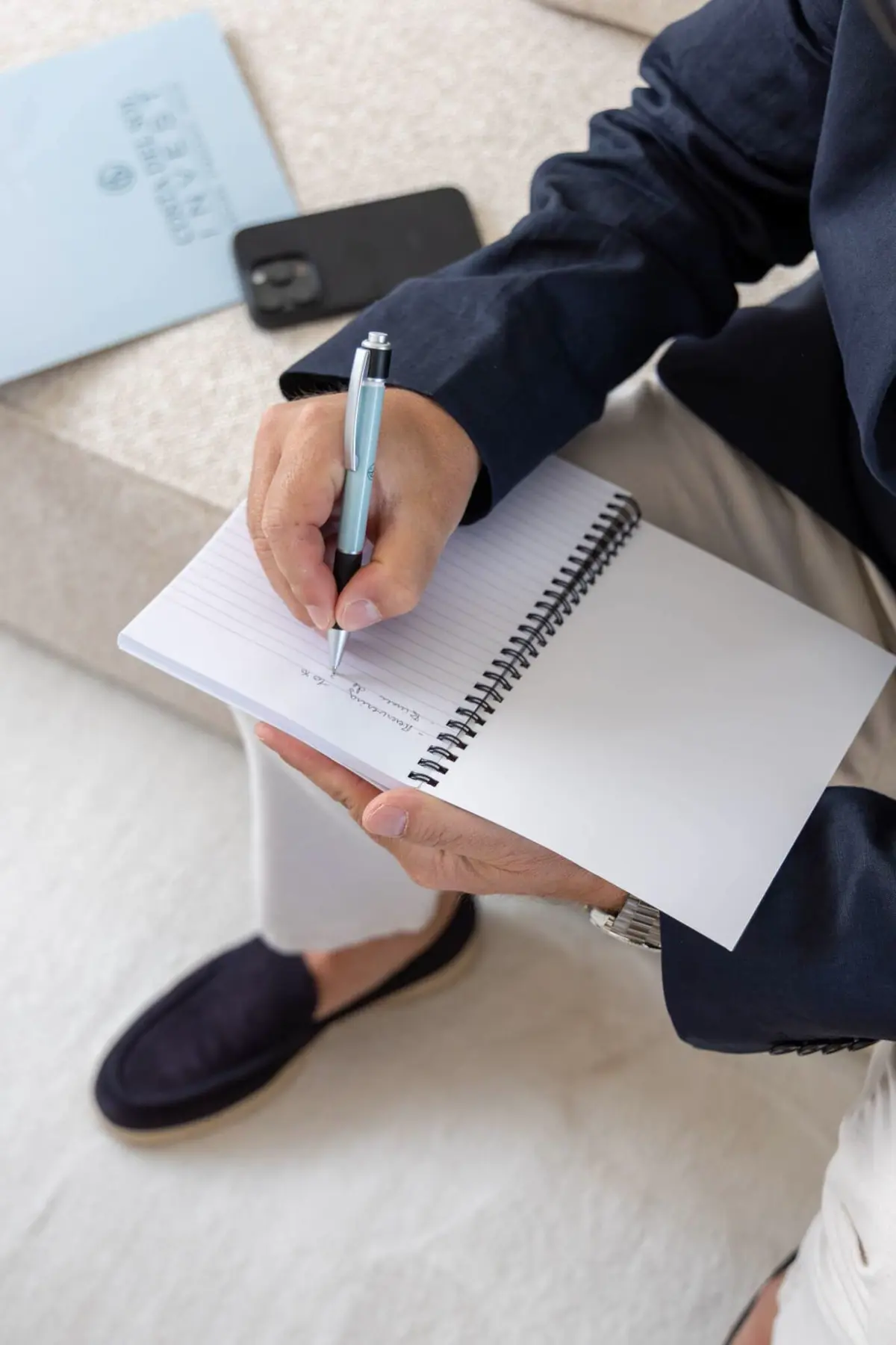 Brand shoot: taking notes with a branded pen and notebook