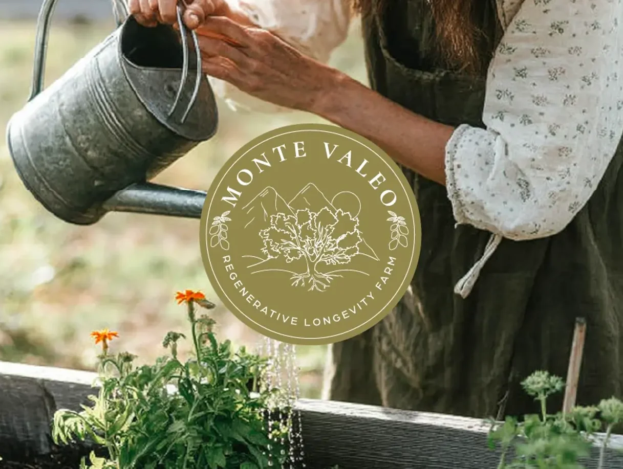 After: the new hand-drawn Monte Valeo badge logo on a garden photo